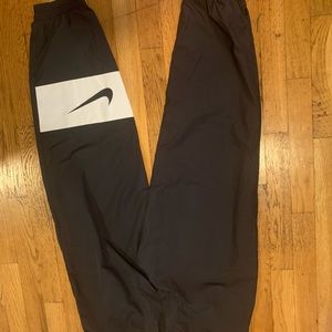 Brand new Nike windbreaker pants size M